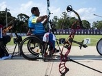 India's Rakesh Kumar (L) and Iran's Ramezan Biabani compete in the men's archery individual ranking round during the Tokyo 2020 Paralympic Games
