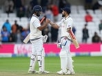 India's captain Virat Kohli, right, and batting partner Cheteshwar Pujara celebrate.(AP) India's captain Virat Kohli, right, and batting partner Cheteshwar Pujara celebrate.(AP)