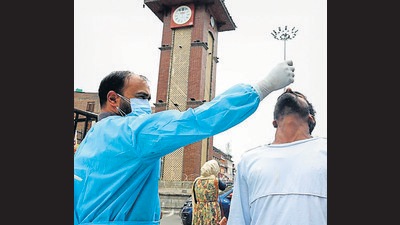A paramedic taking swab sample of a man to conduct a rapid antigen test for Covid-19 in Srinagar on Saturday. (ANI)