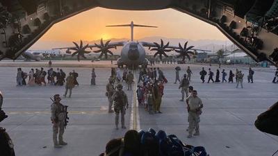 Afghan collaborators, their families, Spanish soldiers and members of the embassy board a Spanish military plane as part of their evacuation, at the Hamid Karzai International Airport in Kabul, Afghanistan. (REUTERS) Afghan collaborators, their families, Spanish soldiers and members of the embassy board a Spanish military plane as part of their evacuation, at the Hamid Karzai International Airport in Kabul, Afghanistan. (REUTERS)