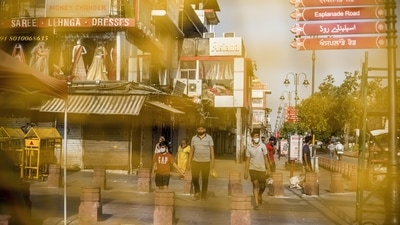 Members of the public walk along a street in Chandni Chowk area near the Red Fort. (Bloomberg)