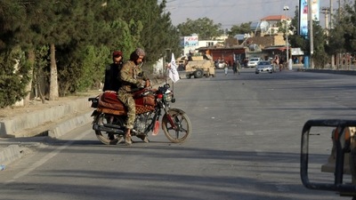 Taliban fighters stand guard at a checkpoint near the gate of Hamid Karzai international Airport in Kabul, Afghanistan. (AP) Taliban fighters stand guard at a checkpoint near the gate of Hamid Karzai international Airport in Kabul, Afghanistan. (AP)