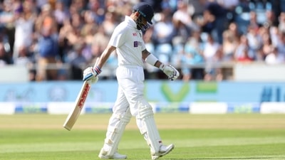 Virat Kohli walks off after being caught out by England's Joe Root (Action Images via Reuters)