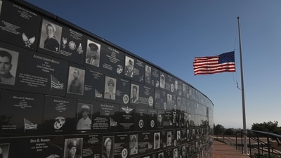 A flag flies at half staff at the Mt. Soledad National War Memorial on August 27, 2021, in La Jolla, California. 170 people were killed, including 13 US Servicemen during an ISIS-led terrorist attack outside of the Kabul airport. (Sandy Huffaker / AFP) A flag flies at half staff at the Mt. Soledad National War Memorial on August 27, 2021, in La Jolla, California. 170 people were killed, including 13 US Servicemen during an ISIS-led terrorist attack outside of the Kabul airport. (Sandy Huffaker / AFP)