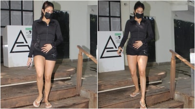 Janhvi wore a black fitted jacket for the session, featuring a front zipper, raised collars and textured details on the side. The actor teamed it with matching black mini shorts. (HT Photo/Varinder Chawla)