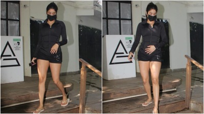 Janhvi was snapped outside the gym in Mumbai today. She chose an all-black outfit for her workout look and showed us how to combine style and comfort for a rigorous exercise session. (HT Photo/Varinder Chawla)