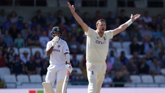 Leeds: England's Ollie Robinson, right, appeals successfully for the wicket of India's Cheteshwar Pujara, left, during the fourth day of third test cricket match between England and India, at Headingley cricket ground in Leeds, England, Saturday, Aug. 28, 2021. AP/PTI(AP08_28_2021_000128A)(AP)