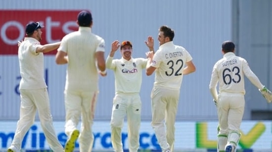 England's Craig Overton, second right, celebrates with teammates the dismissal of India's Mohammad Siraj during the fourth day of third test cricket match between England and India, at Headingley cricket ground in Leeds, England, Saturday, Aug. 28, 2021. (AP Photo/Jon Super)(AP)
