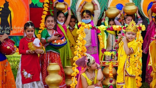 Children dress up as Lord Krishna and takes part in a fancy dress competition ahead of the 'Janmashtami festival', in Patiala.(PTI)