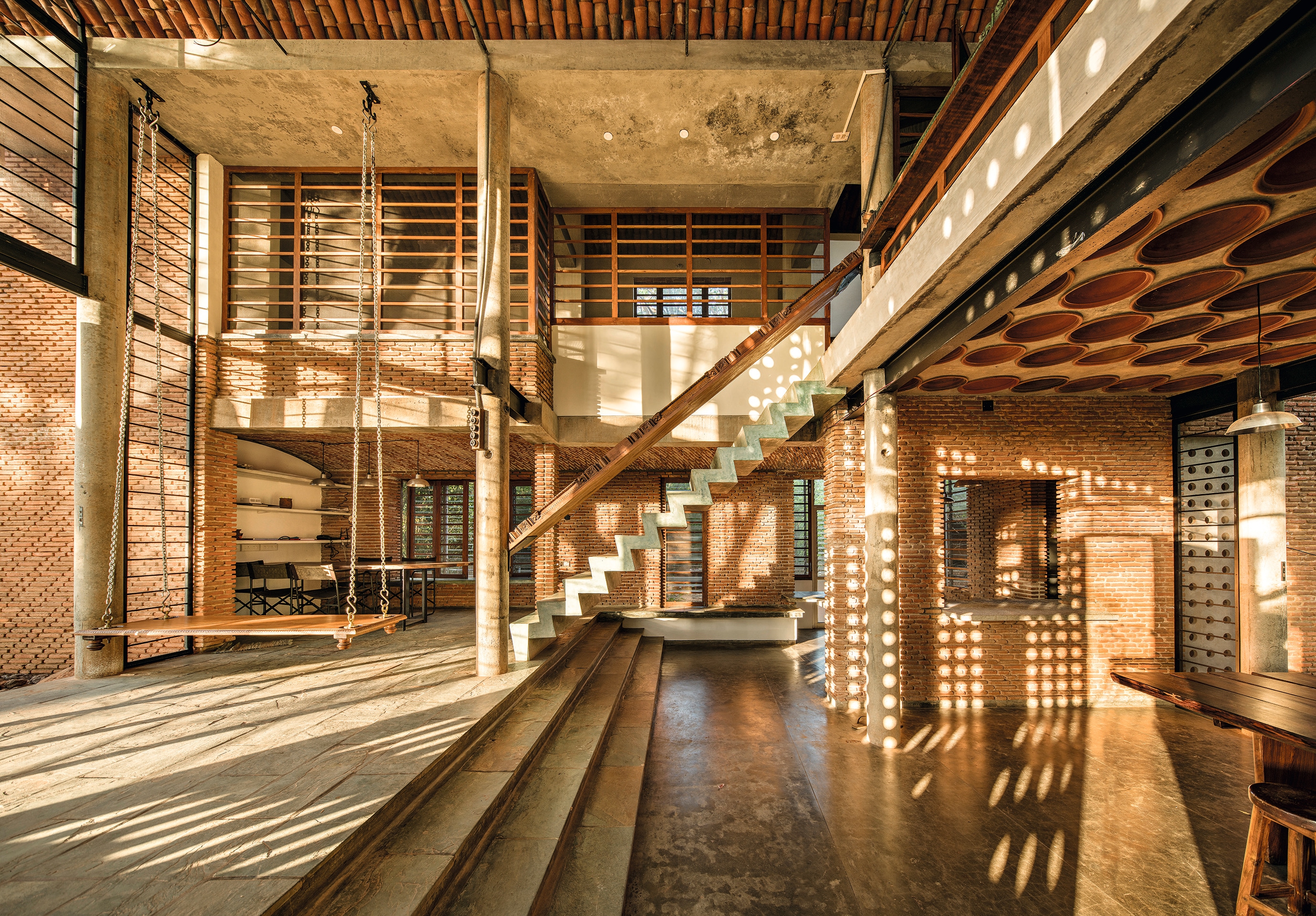 Anupama Kundoo’s own home, Wall House in Auroville, used handmade mud bricks over polluting factory-made ones. Its terracotta roof was developed with ideas from local potters. The result: a sleek, avant-garde home that is still indisputably Indian. (Javier Callejas)