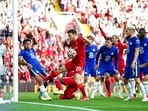Chelsea's Reece James, second left, handballs on the goal line which results in a red card and a penalty given to Liverpool. Chelsea's Reece James, second left, handballs on the goal line which results in a red card and a penalty given to Liverpool.