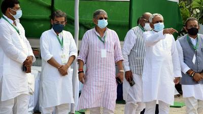 Bihar Chief Minister Nitish Kumar along with JD(U) national president Rajiv Ranjan Singh and leader Upendra Kushwaha at Janta Dal-United party's national council meeting in Patna on Sunday. (ANI PHOTO.) Bihar Chief Minister Nitish Kumar along with JD(U) national president Rajiv Ranjan Singh and leader Upendra Kushwaha at Janta Dal-United party's national council meeting in Patna on Sunday. (ANI PHOTO.)