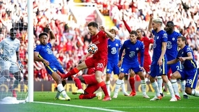 Chelsea's Reece James, second left, handballs on the goal line which results in a red card and a penalty given to Liverpool. (AP) Chelsea's Reece James, second left, handballs on the goal line which results in a red card and a penalty given to Liverpool. (AP)