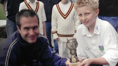 Michael Vaughan presentin aan award to 10-year-old Joe Root (Twitter)