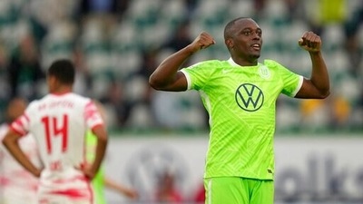 Jerome Roussillon fires Wolfsburg top of Bundesliga (AP)