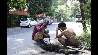 Most times, sewermen in Ludhiana are seen entering manholes with only a safety belt. (HT file)