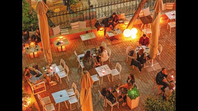 It’s better to eat far apart but it is best to eat outdoors or at places with very high ceilings It’s better to eat far apart but it is best to eat outdoors or at places with very high ceilings