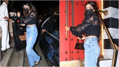 Khushi rounded off her date-night look by wearing a black face mask and leaving her locks open in a middle parting. She accessorised her outfit with a small textured black top handle bag and silver hoops. (HT Photo/Varinder Chawla)