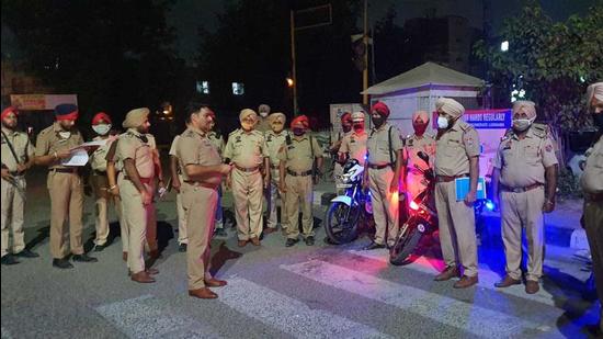 Police gearing up for a midnight patrol at Bharat Nagar Chowk in Ludhiana on Sunday. (HT PHOTO) Police gearing up for a midnight patrol at Bharat Nagar Chowk in Ludhiana on Sunday. (HT PHOTO)
