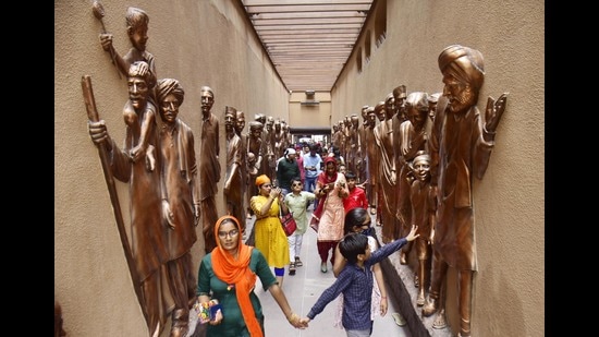 Visitors at the refurbished Jallianwala Bagh on the first day after it was reopened for public on Sunday. (Sameer Sehgal /HT)