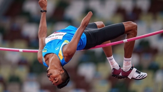 Nishad Kumar of India competes in the men's high jump - T47 final at Tokyo 2020 Paralympic Games in Tokyo.(AP)