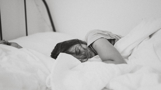 Get more sleep: It is highly unlikely to have a good night's sleep after drinking. So, the next day, make sure to hydrate yourself, keep your phone on DND and go off to sleep.(Unsplash)