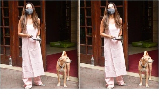 Malaika left her perfectly blow-dried locks open in a middle-parting with the ethnic look. She also wore a broad-strap watch and embellished juttis to complete the ensemble.(HT Photo/Varinder Chawla)