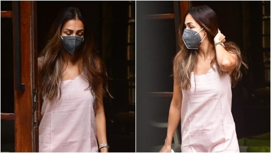 Malaika slipped into a sleeveless round-neck long kurta featuring a loose silhouette, perfect for summer outings. She teamed it with a straight fit, flared matching pants.(HT Photo/Varinder Chawla)