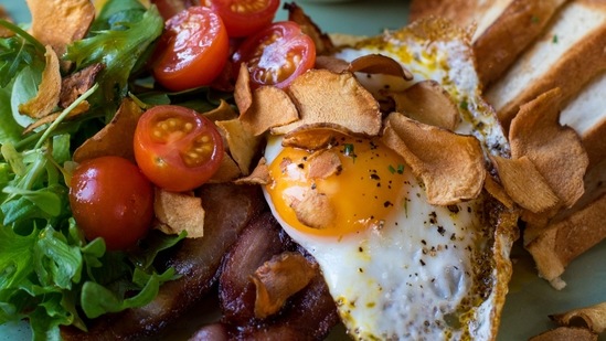 Eat healthy before and after drinking: Having food simultaneously with alcohol will help your body more efficiently metabolize the alcohol. This will increase anti-diuretic hormone levels (ADH), sugar fructose, and blood flow to the liver. All this will quickly break down alcohol.(Unsplash)