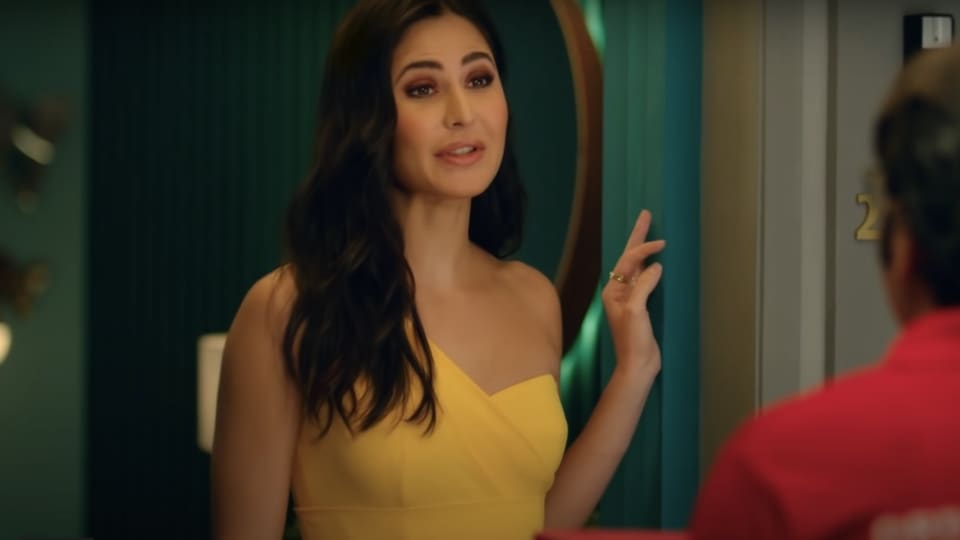 Katrina Kaif in a one-shoulder yellow dress. (YouTube/Zomato)