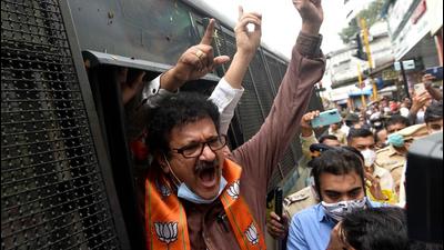 Police detain BJP workers after they protest against Maharashtra government demanding reopening of temples as part of their statewide agitation amid Covid curbs, at Kandivli in Mumbai on Monday. (HT PHOTO) Police detain BJP workers after they protest against Maharashtra government demanding reopening of temples as part of their statewide agitation amid Covid curbs, at Kandivli in Mumbai on Monday. (HT PHOTO)