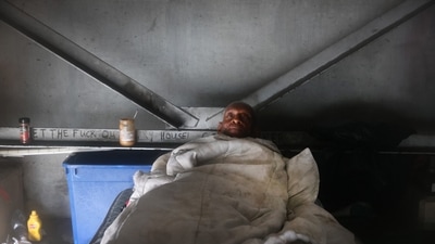 Michael Brown, who is homeless, rides out Hurricane Ida from his bed under a highway overpass on August 29. President Joe Biden approved a federal disaster declaration for Louisiana to assist with recovery. While the storm’s impact wasn’t fully clear early on August 30, and first responders didn’t plan to start answering search and rescue calls until sunrise, signs have already emerged that Ida’s toll has been dire. (Scott Olson / AFP) Michael Brown, who is homeless, rides out Hurricane Ida from his bed under a highway overpass on August 29. President Joe Biden approved a federal disaster declaration for Louisiana to assist with recovery. While the storm’s impact wasn’t fully clear early on August 30, and first responders didn’t plan to start answering search and rescue calls until sunrise, signs have already emerged that Ida’s toll has been dire. (Scott Olson / AFP)