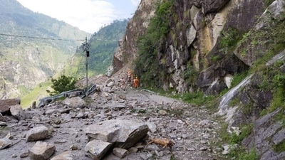 Members of the National Disaster Response Force (NDRF) search for survivors during a rescue operation at the site of a landslide in Kinnaur, Himachal Pradesh. (REUTERS)