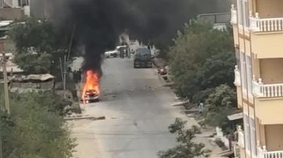 A view of remnants of flames from cars where rockets towards Kabul's international airport were fired from but were intercepted by a missile defense system, in Kabul, Afghanistan (REUTERS)