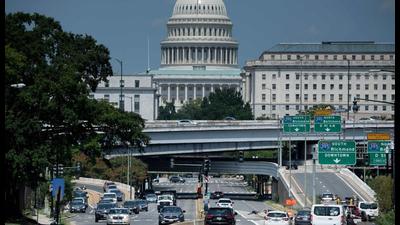People drive near Capitol Hill in Washington, DC. (AFP) People drive near Capitol Hill in Washington, DC. (AFP)