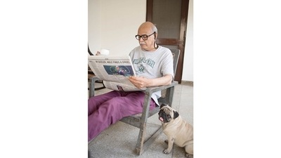 Saleem Kidwai, with Pugli at home in Lucknow, c. 2015. (Image courtesy the artist and Hales Gallery, Stephen Bulger Gallery and Vadehra Art Gallery. © Sunil Gupta. All Rights Reserved, DACS 2021)