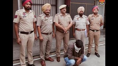 The accused in Khanna police custody in Ludhiana on Monday. (HT PHOTO)