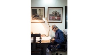 Saleem Kidwai at his desk at home in Lucknow; 2015. (Image courtesy the artist and Hales Gallery; Stephen Bulger Gallery and Vadehra Art Gallery. © Sunil Gupta. All Rights Reserved; DACS 2021)