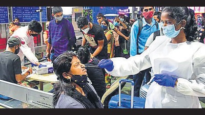 A BMC health worker collects swab sample of a passenger at CSMT in Mumbai on Monday. (Bhushan Koyande/ HT) A BMC health worker collects swab sample of a passenger at CSMT in Mumbai on Monday. (Bhushan Koyande/ HT)