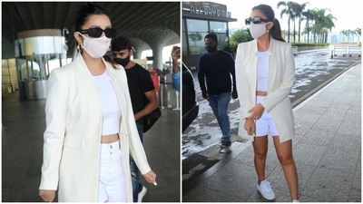 Parineeti was snapped at the airport sporting an all-white look for her flight out of Mumbai. She mixed chic elements keeping in mind the comfort factor, and we are taking style cues. (HT Photo/Varinder Chawla)