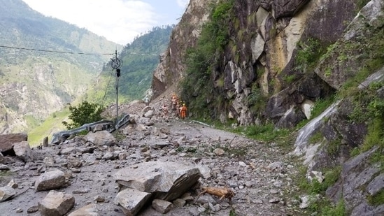 Members of the National Disaster Response Force (NDRF) search for survivors during a rescue operation at the site of a landslide in Kinnaur, Himachal Pradesh.(REUTERS)