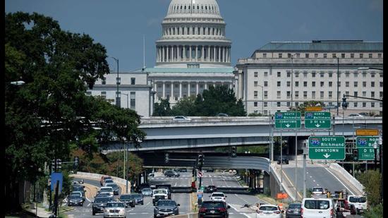 People drive near Capitol Hill in Washington, DC. (AFP) People drive near Capitol Hill in Washington, DC. (AFP)
