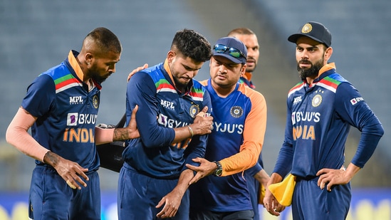 Indian cricketer Shreyas Iyer being attended by teammates.(PTI)