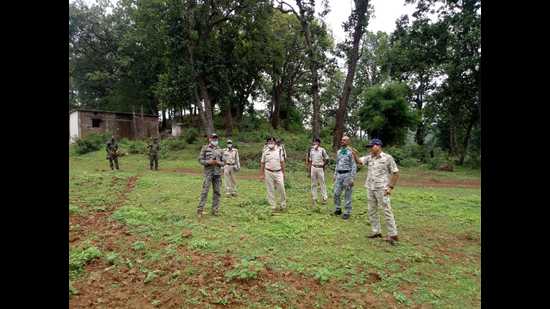 Officers survey Baiga Chak for Maoist camps. (Sourced) Officers survey Baiga Chak for Maoist camps. (Sourced)
