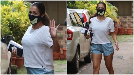 Today, Malaika was spotted outside the yoga studio in Mumbai in a simple ensemble. She nailed the gym look in the classic white and blue combination.(HT Photo/Varinder Chawla)