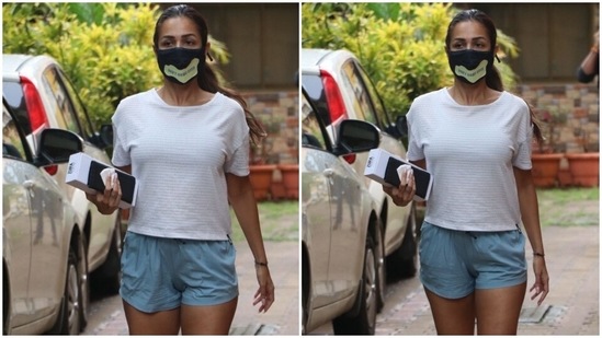 Malaika teamed the workout-ready ensemble with pink flip-flops and a sleeked back, fuss-free low ponytail. She also wore a printed face mask with the outfit to keep herself safe during the pandemic.(HT Photo/Varinder Chawla)