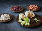 Garlic not just enhances the flavour of Indian cuisine but also treats various medical conditions. Here are seven health benefits of having raw garlic that are supported by human research.(Unsplash)