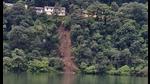 A landslide on one side of Nainital lake had debris and big boulders falling into the waters on Tuesday morning. (Photo by Raajiv Kala)