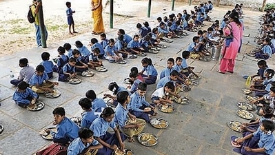 Children have mid-day meal at a government school in Jaipur Children have mid-day meal at a government school in Jaipur