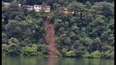 A landslide on one side of Nainital lake had debris and big boulders falling into the waters on Tuesday morning. (Photo by Raajiv Kala)